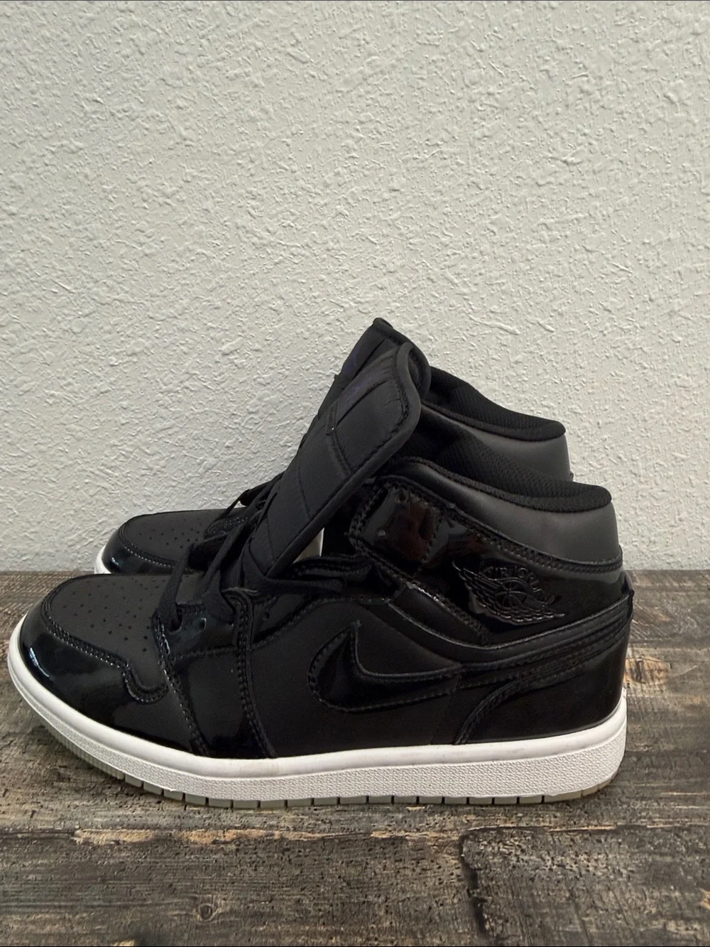 Jordan Black Patent Leather High-Top Sneakers with Purple Logo
